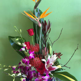 Tall tropical bouquet with bird of paradise, roses, orchids, and lilies