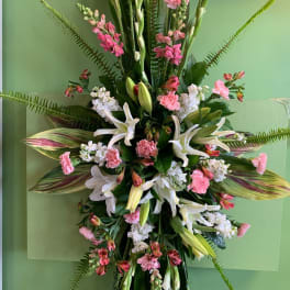 Tall floral spray with white lilies and pink carnations