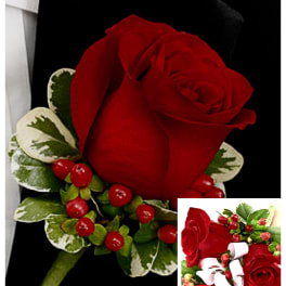 Red rose boutonniere with variegated leaves and red berries