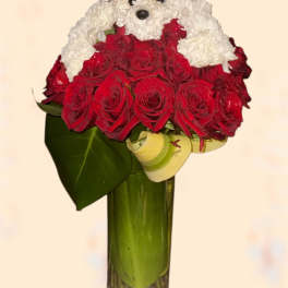 Red rose bouquet arranged as a teddy bear in a glass vase