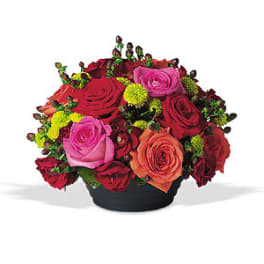 Mixed roses in a low black container