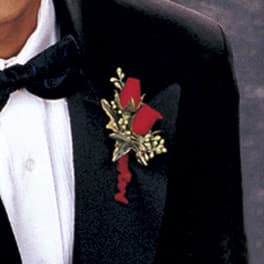 Red rose boutonniere pinned to a black tuxedo jacket