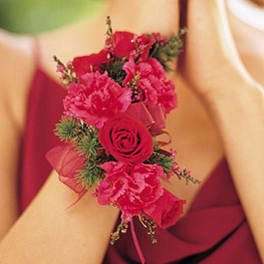 Pink floral wrist corsage with roses and carnations
