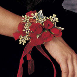 Red rose wrist corsage with a ribbon tie