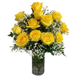 Yellow roses in a glass vase with baby's breath