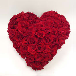 Heart-shaped arrangement of red roses