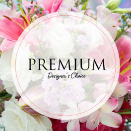 Pink and white mixed flower bouquet with a premium label