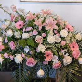 Large pink and white floral spray with roses and lilies