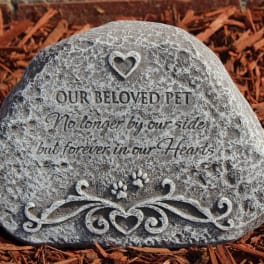 Memorial stone engraved with "Our Beloved Pet" and a heart design