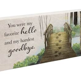 Decorative memorial sign with a bridge and the words "You were my favorite hello and my hardest goodbye."