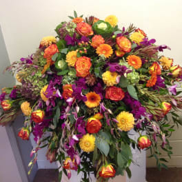 Large mixed bouquet with orange, yellow, and purple flowers