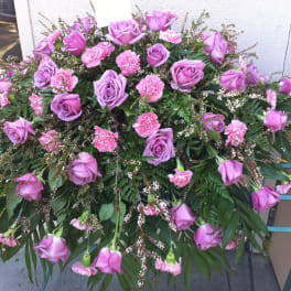 Large pink and lavender floral spray with roses and carnations