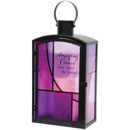 Black lantern with purple glass panels and printed text