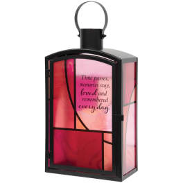 Black lantern with pink glass panels and a memorial quote