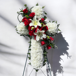 Standing floral spray with red roses, white lilies, and white chrysanthemums