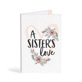 Greeting card reading "A Sister's Love" with floral accents