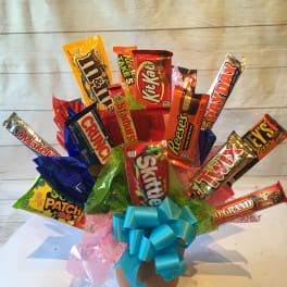 Candy bouquet in a pot with a blue ribbon bow