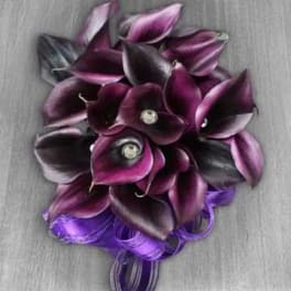 Purple calla lily bouquet with a ribbon wrap