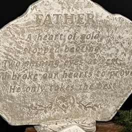 Decorative stone plaque with an engraved Father quote