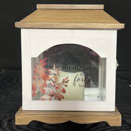 Wooden memorial lantern with a candle and autumn leaf design