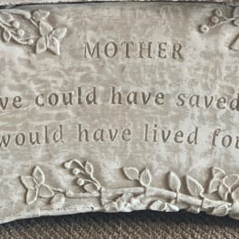 Stone memorial plaque with the word Mother and an engraved sympathy message