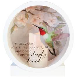 Memorial candle with a hummingbird and floral background