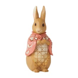 Decorative rabbit figurine wearing a pink scarf