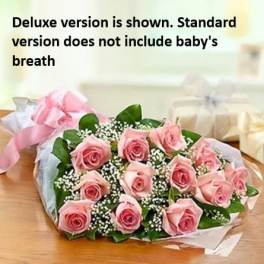 Bouquet of pink roses with baby's breath and ribbon wrapping