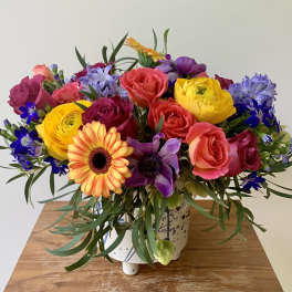 Colorful mixed bouquet in a white ceramic vase