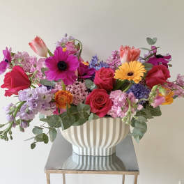 Colorful mixed bouquet in a white ribbed vase