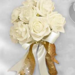 White rose bouquet with satin and gold ribbon accents