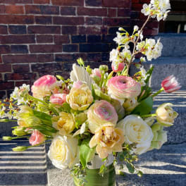 Bouquet of pink and white flowers in a clear glass vase