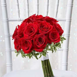 Bouquet of red roses with variegated greenery