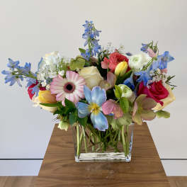Colorful mixed bouquet in a clear glass vase