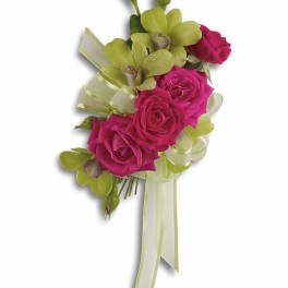 Pink roses with green orchids and ribbon in a cascading bouquet