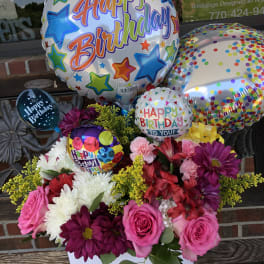 Birthday balloon bouquet with mixed flowers in a white box
