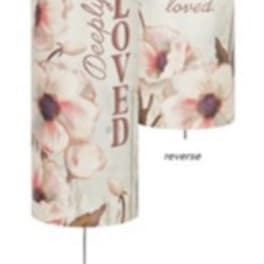 Two hanging memorial wind chimes with floral prints and "Loved" text