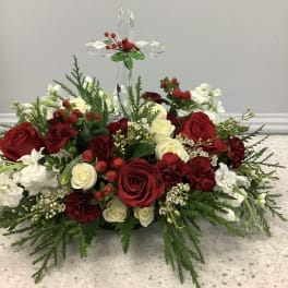 Red and white rose arrangement with a crystal cross topper
