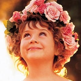 Young girl wearing a pink rose flower crown