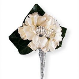 Cream flower boutonniere with dark green leaves and a silver stem wrap