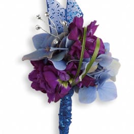 Purple and blue corsage with hydrangea and ribbon accents