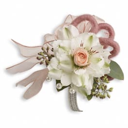 White floral wrist corsage with a peach rose and pink ribbon