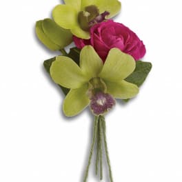Small orchid and rose boutonniere with green and pink blooms