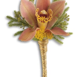 Boutonniere with pink orchid petals and yellow center on a wrapped stem