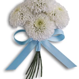 White chrysanthemum boutonniere with a blue ribbon bow