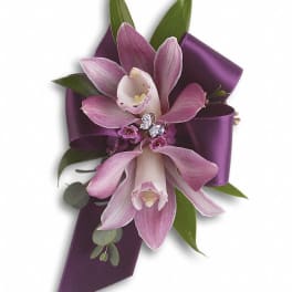 Purple orchid corsage with satin ribbon and jeweled accent