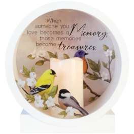 Memorial candle with birds and a quote in a white holder