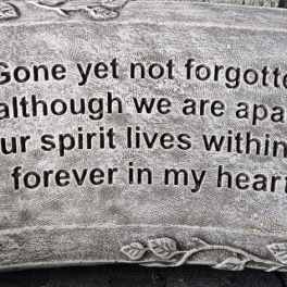 Rectangular gray memorial stone with heart cutouts and engraved verse about remembrance and love.