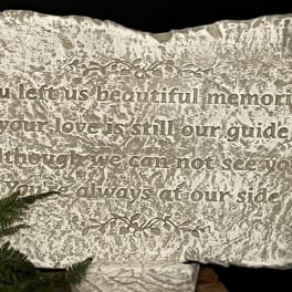 Engraved memorial stone with a sympathy message