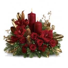Red floral centerpiece with candles and gold accents